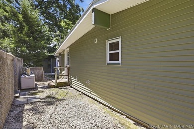 Enjoy the Lake of the Ozarks lifestyle with this charming Rocky - photo 26