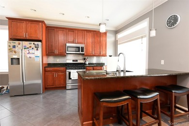 Welcome to this beautifully maintained brick two-family home in - photo 3