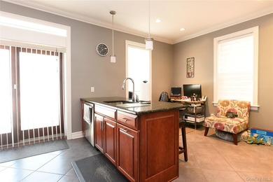 Welcome to this beautifully maintained brick two-family home in - photo 4