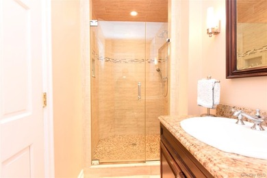 Welcome to this beautifully maintained brick two-family home in - photo 9