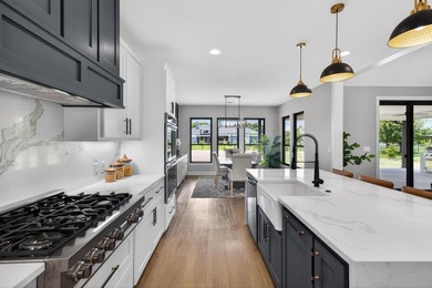 Welcome to this stunning 4-bedroom, 3-bathroom home in the gated - photo 11