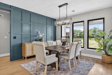 Welcome to this stunning 4-bedroom, 3-bathroom home in the gated - photo 13