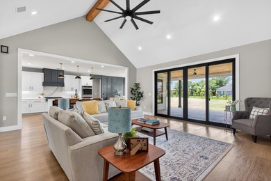Welcome to this stunning 4-bedroom, 3-bathroom home in the gated - photo 17