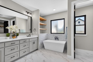 Welcome to this stunning 4-bedroom, 3-bathroom home in the gated - photo 23