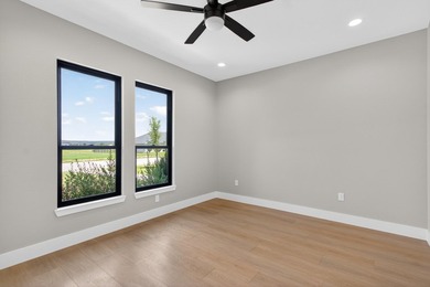 Welcome to this stunning 4-bedroom, 3-bathroom home in the gated - photo 27