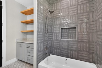 Welcome to this stunning 4-bedroom, 3-bathroom home in the gated - photo 29