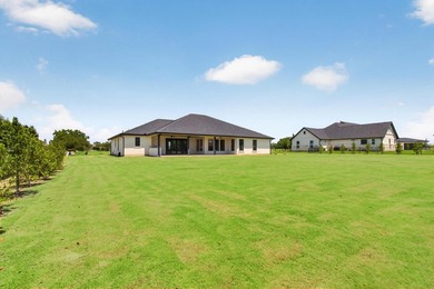 Welcome to this stunning 4-bedroom, 3-bathroom home in the gated - photo 35