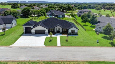 Welcome to this stunning 4-bedroom, 3-bathroom home in the gated - photo 38
