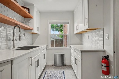 Completely renovated and move-in ready, this stylish two-level - photo 10