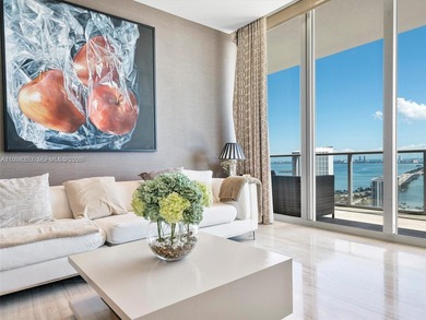 Penthouse 207 is a two-story residence offering expansive