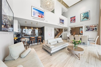 Penthouse 207 is a two-story residence offering expansive