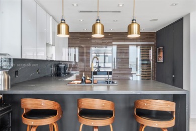 Penthouse 207 is a two-story residence offering expansive