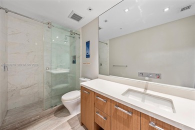 Penthouse 207 is a two-story residence offering expansive