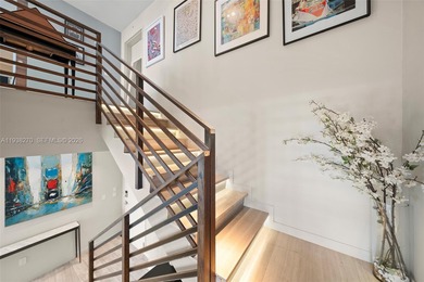 Penthouse 207 is a two-story residence offering expansive