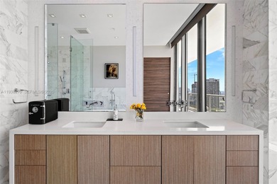 Penthouse 207 is a two-story residence offering expansive