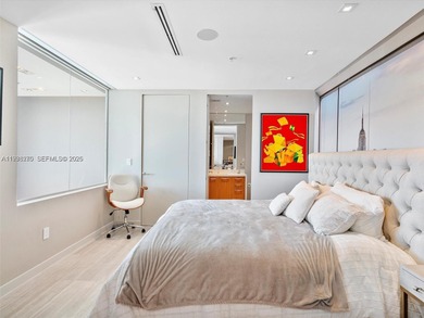 Penthouse 207 is a two-story residence offering expansive