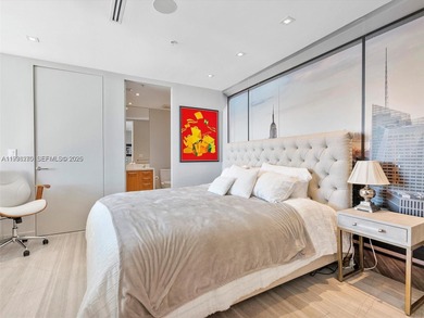 Penthouse 207 is a two-story residence offering expansive