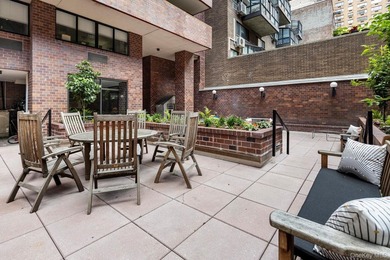 Perched on the 20th floor of a full-service Upper East Side - photo 26