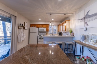 Discover lake living at its finest in the iconic Tan-Tar-A