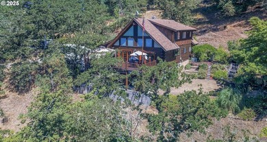 This beautiful log home features soaring ceilings and large - photo 1