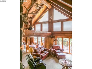 This beautiful log home features soaring ceilings and large - photo 4