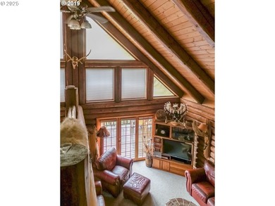 This beautiful log home features soaring ceilings and large - photo 5