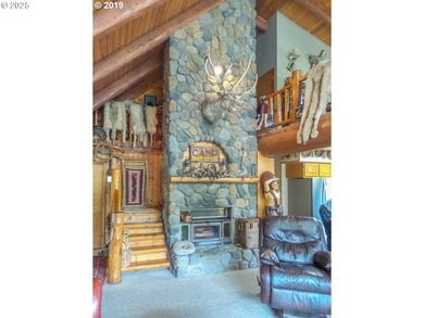 This beautiful log home features soaring ceilings and large - photo 6