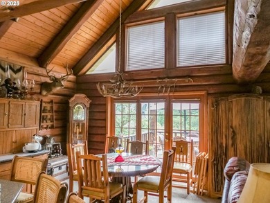This beautiful log home features soaring ceilings and large - photo 7