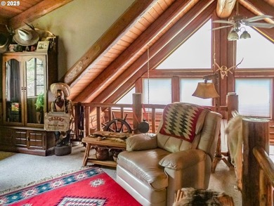 This beautiful log home features soaring ceilings and large - photo 8
