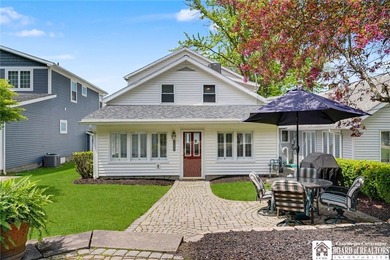 Nestled along the tranquil shores of Chautauqua Lake, this - photo 1