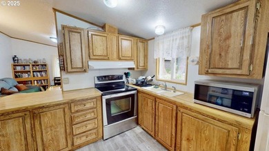 Move-in ready 1991 Skyline home in Port Orford! Features include - photo 8