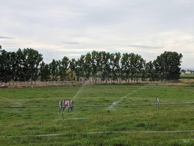 This well-maintained 3-bedroom, 2-bathroom brick home sits on 5