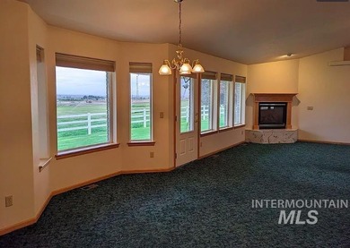 This well-maintained 3-bedroom, 2-bathroom brick home sits on 5