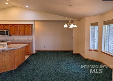 This well-maintained 3-bedroom, 2-bathroom brick home sits on 5