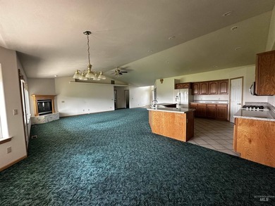 This well-maintained 3-bedroom, 2-bathroom brick home sits on 5