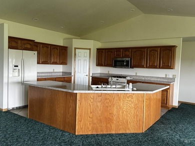 This well-maintained 3-bedroom, 2-bathroom brick home sits on 5