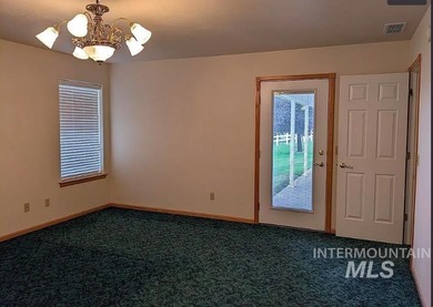 This well-maintained 3-bedroom, 2-bathroom brick home sits on 5