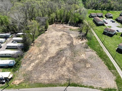 1.8 ACRE COMMERCIAL SITE in Mason County featuring a cleared - photo 2