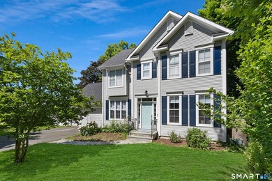 Discover this delightful colonial, tucked away on a private - photo 1