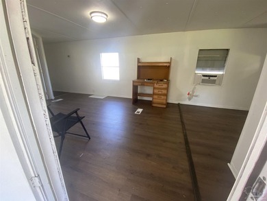 This corner lot property includes a mobile home featuring 2 - photo 4