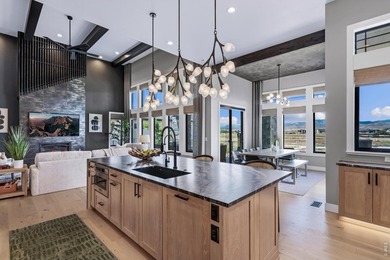 Backing breathtaking water and mountain views, this stunning - photo 11