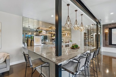 Backing breathtaking water and mountain views, this stunning - photo 36