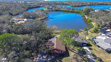 VIEW-TIFUL!! Waterfront living reaches a whole new level on - photo 3