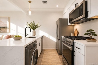 **Elevator Building** **Balcony** **In-unit Washer/Dryer Combo** - photo 3