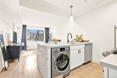 **Elevator Building** **Balcony** **In-unit Washer/Dryer Combo** - photo 8