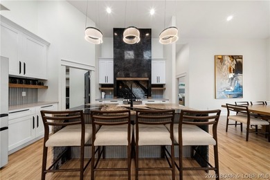 Experience luxury lakefront living in this fully furnished - photo 11