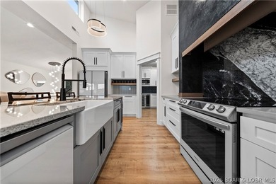 Experience luxury lakefront living in this fully furnished - photo 12