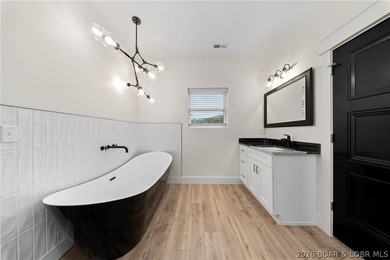 Experience luxury lakefront living in this fully furnished - photo 25