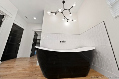 Experience luxury lakefront living in this fully furnished - photo 27