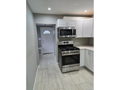 Centrally located two-family home offering a strong opportunity - photo 5